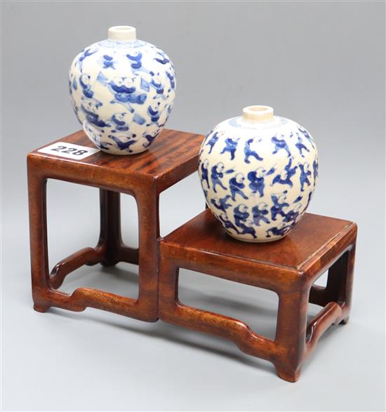 Two Chinese crackleglaze small blue and white vases, painted with figures, late 19th century plus wood scholars stand, tallest 7cm